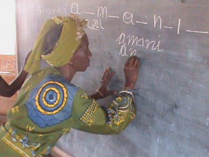 au-education-litterate-woman-writing-on-blackboard2-2013.jpg