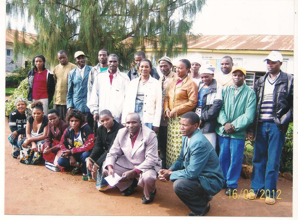 Paulina Samata poses with local teachers, government officers, members of a local school's parent board and friends