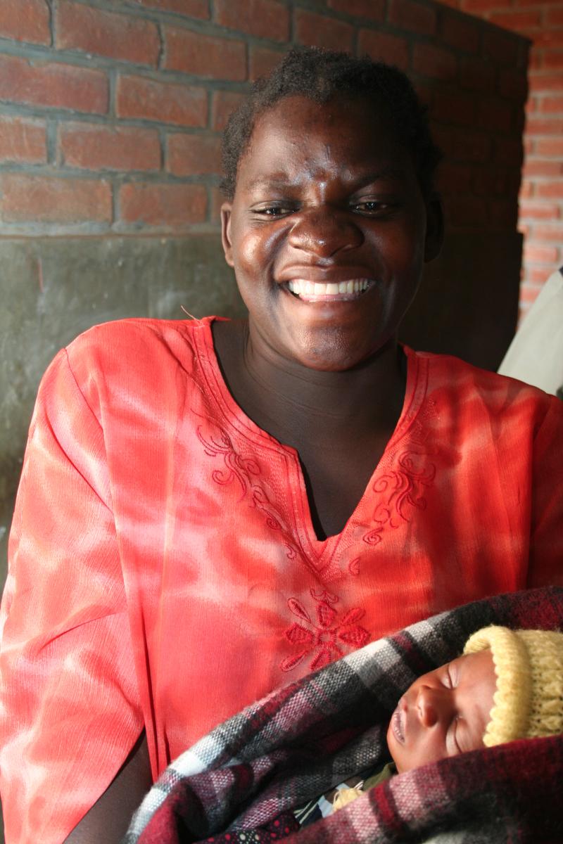 Malawian mother holding her baby