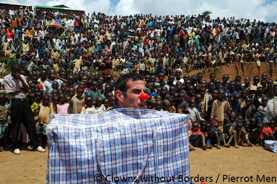 Clown performing in front of children in Rwanda