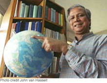 Muhammad Yunus point to Bangladesh on globe