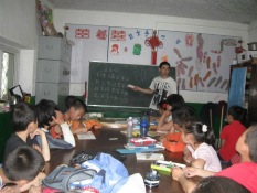 Migrant children learn in classroom