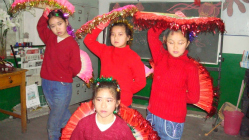 Migrant girls perform a traditional dance