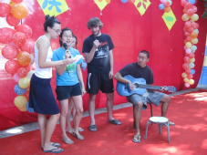 Migrant children and volunteers in China sing 