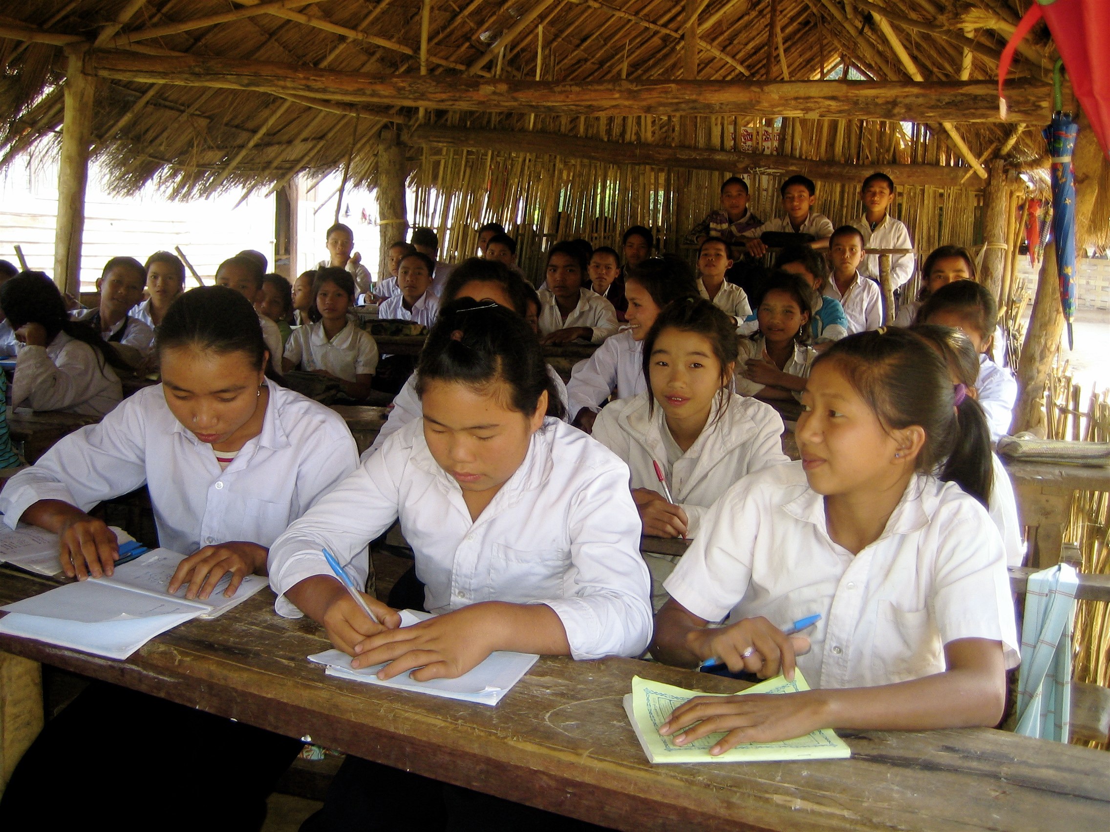 ea-laos-education-girls-writing-at-school1.jpg